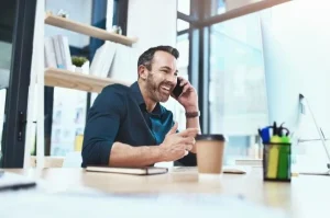 Salesperson practising confident cold calling in Australia during a prospecting call